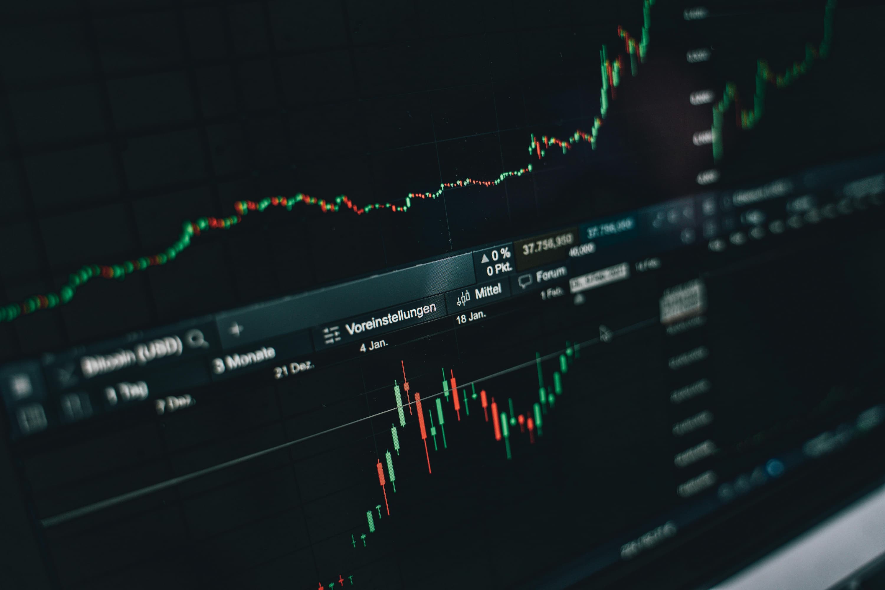 A close-up view of a dark digital screen displaying financial trading data